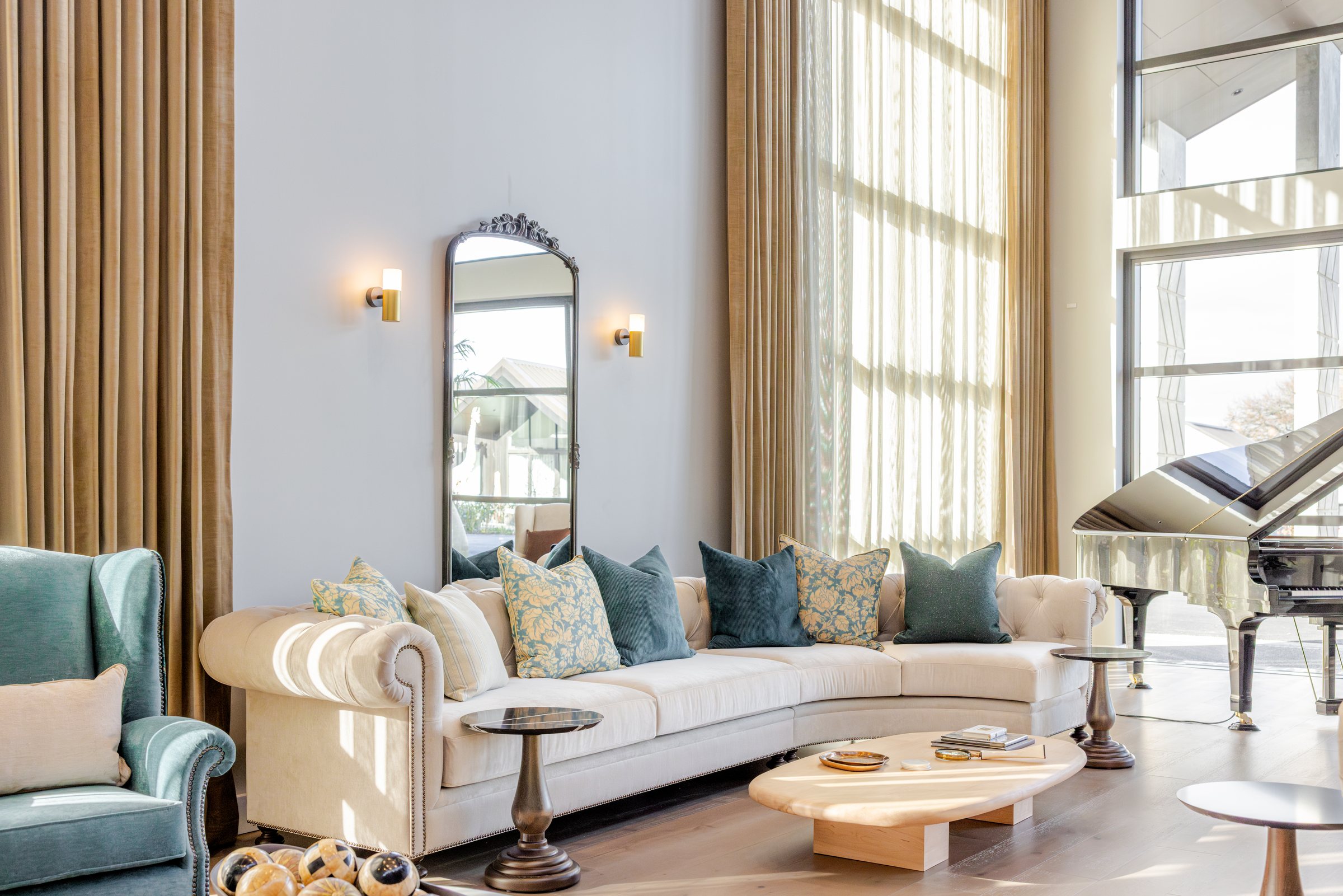 Lounge interior with a grand piano at Tamahere Country Club, photographed for Acorn Furniture