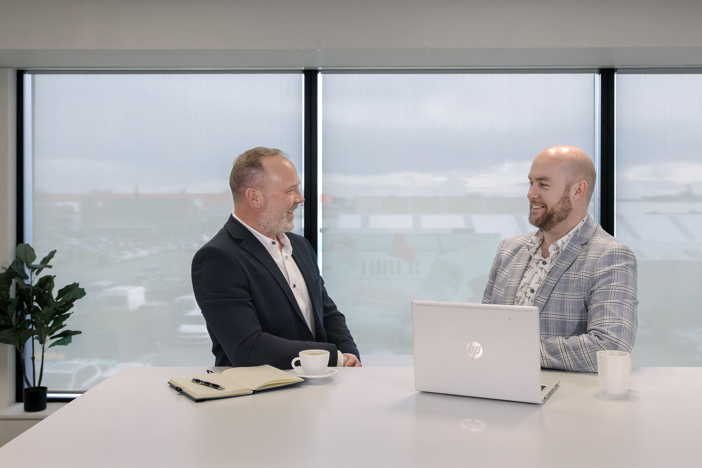 Two colleagues in conversation during a Stellar Recruitment office shoot