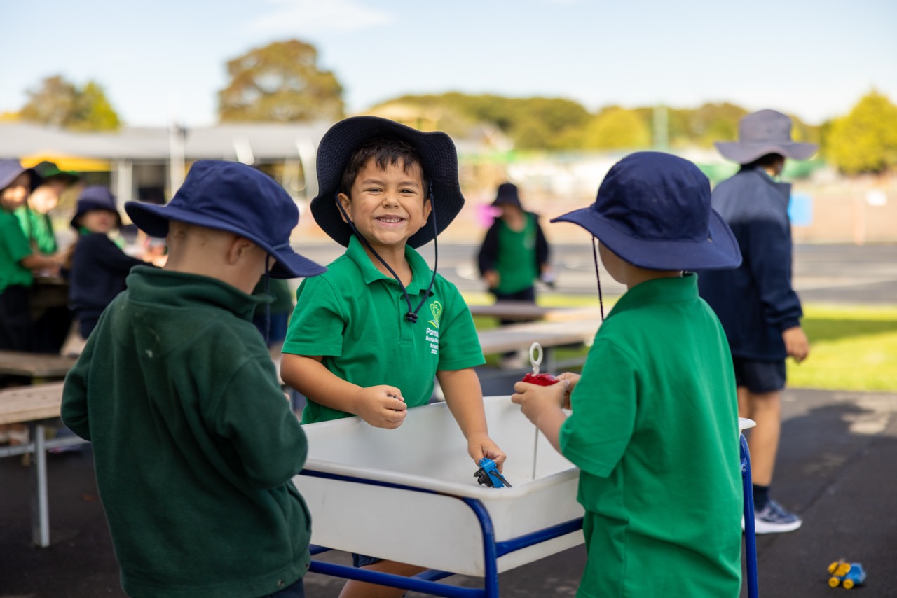 Pareawa Banks Avenue School students laughing together at an outdoor table